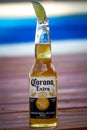 Corona Extra with pool on background